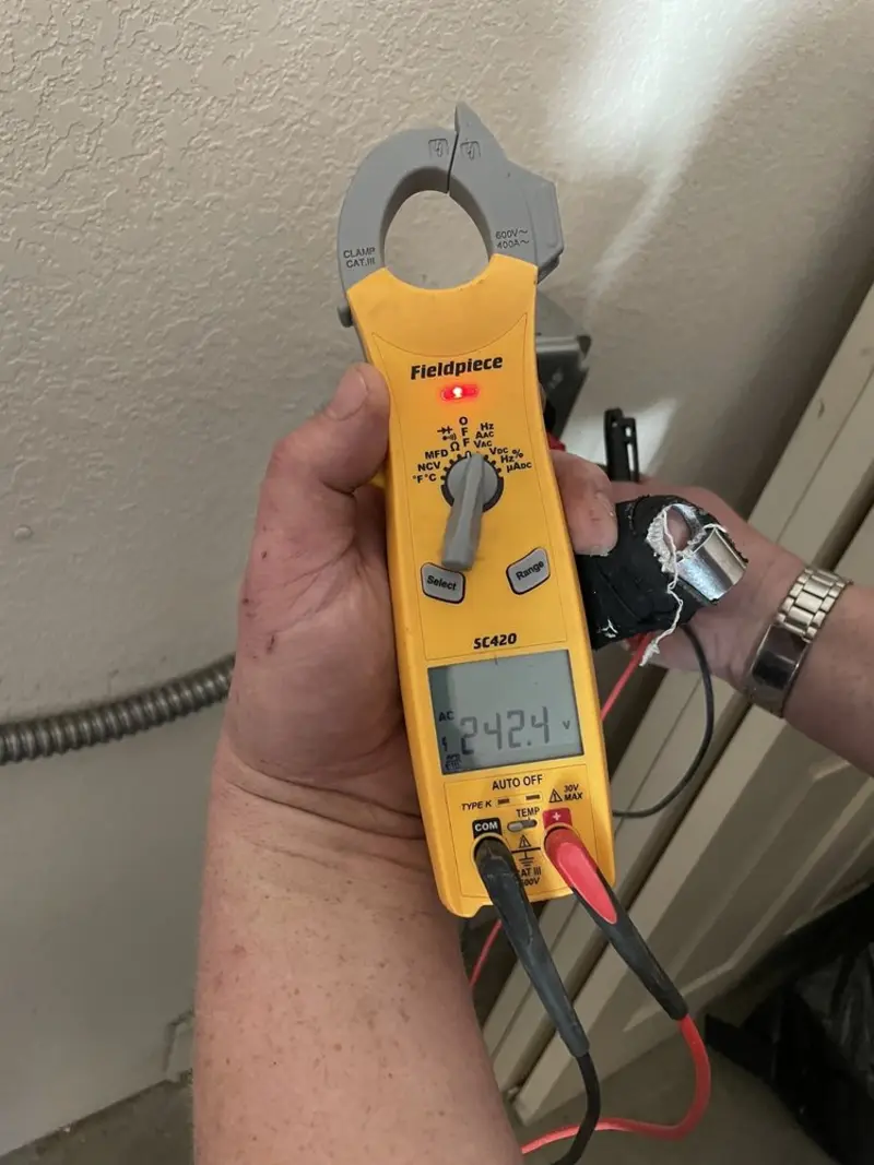 Voltage testing with clamp meter during Outlet Installation in Brunswick